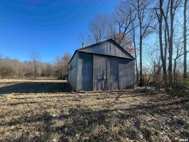 a backyard of house with large trees