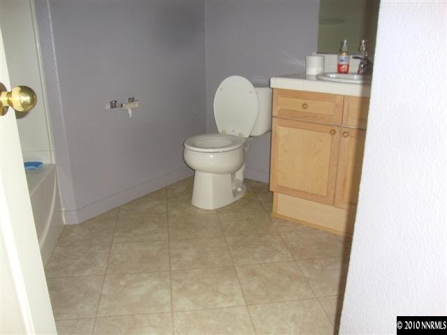 10255 Lucente Way Reno, NV 89521 - Photo 6 of 10 a bathroom with a toilet and a sink