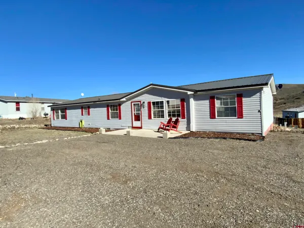 a front view of a house with yard