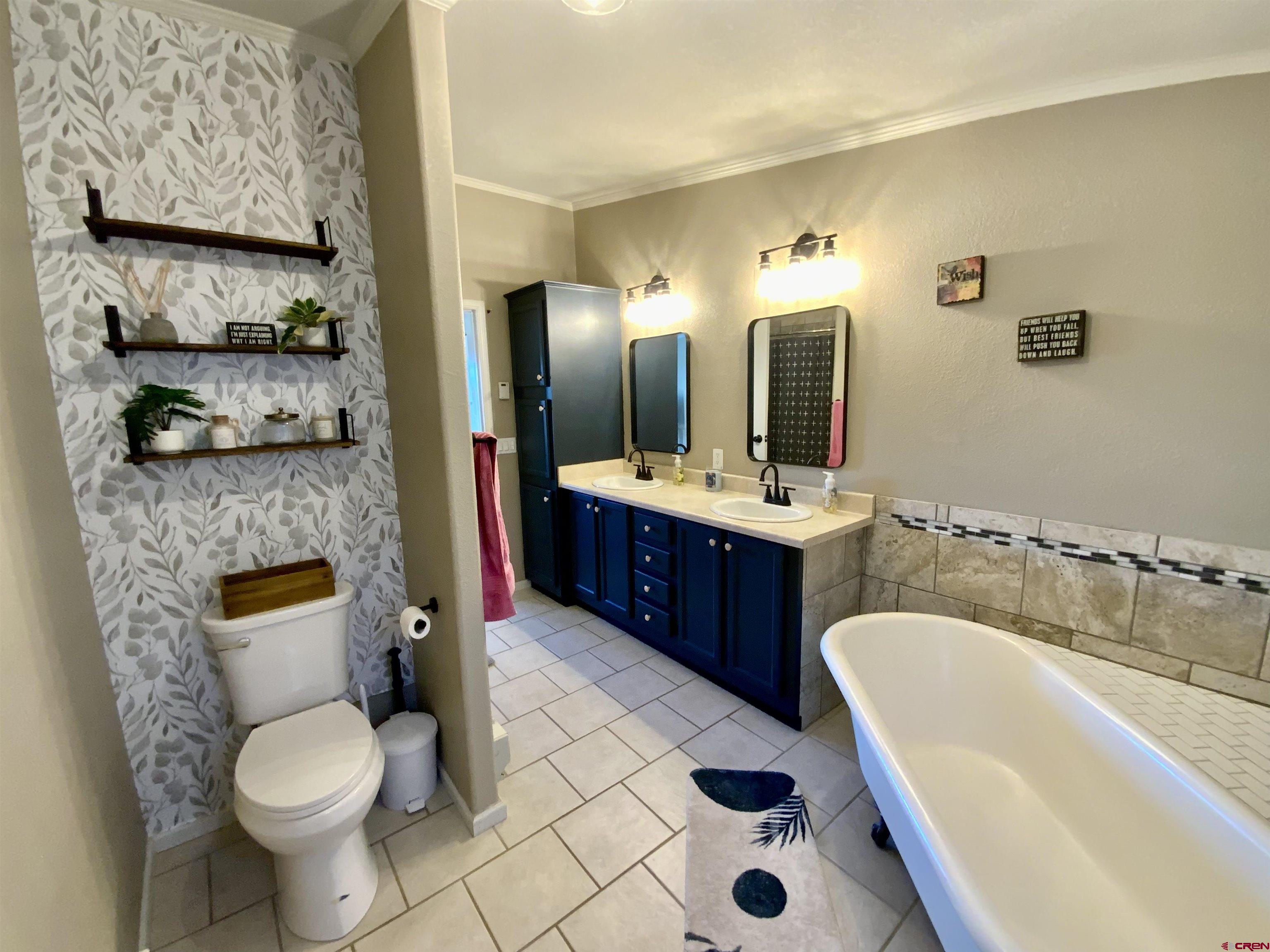 13 Ridge Lane Gunnison, CO 81230 - Photo 13 of 24 a bathroom with a sink toilet and shower