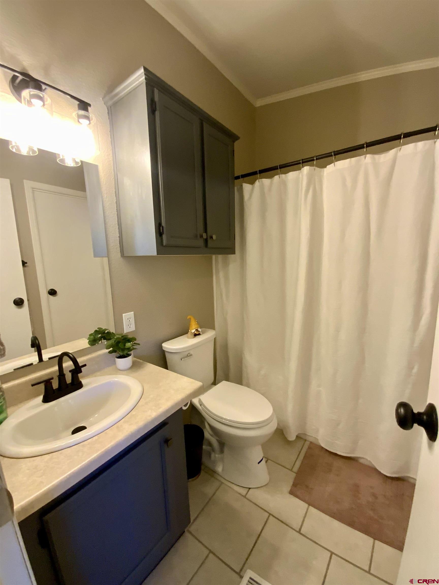 13 Ridge Lane Gunnison, CO 81230 - Photo 21 of 24 a bathroom with a sink and a mirror