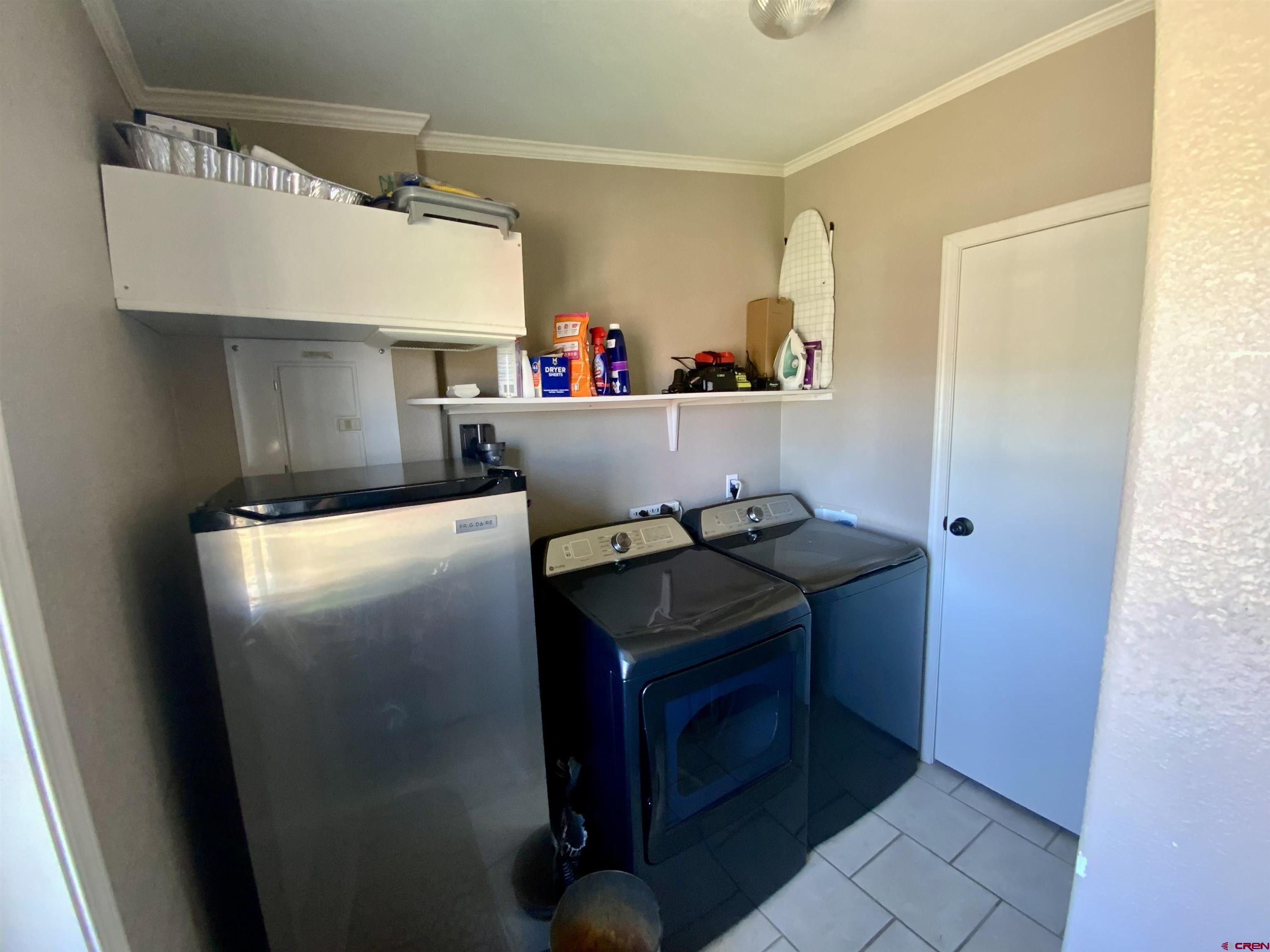 13 Ridge Lane Gunnison, CO 81230 - Photo 23 of 24 a kitchen with stainless steel appliances granite countertop a refrigerator and a stove