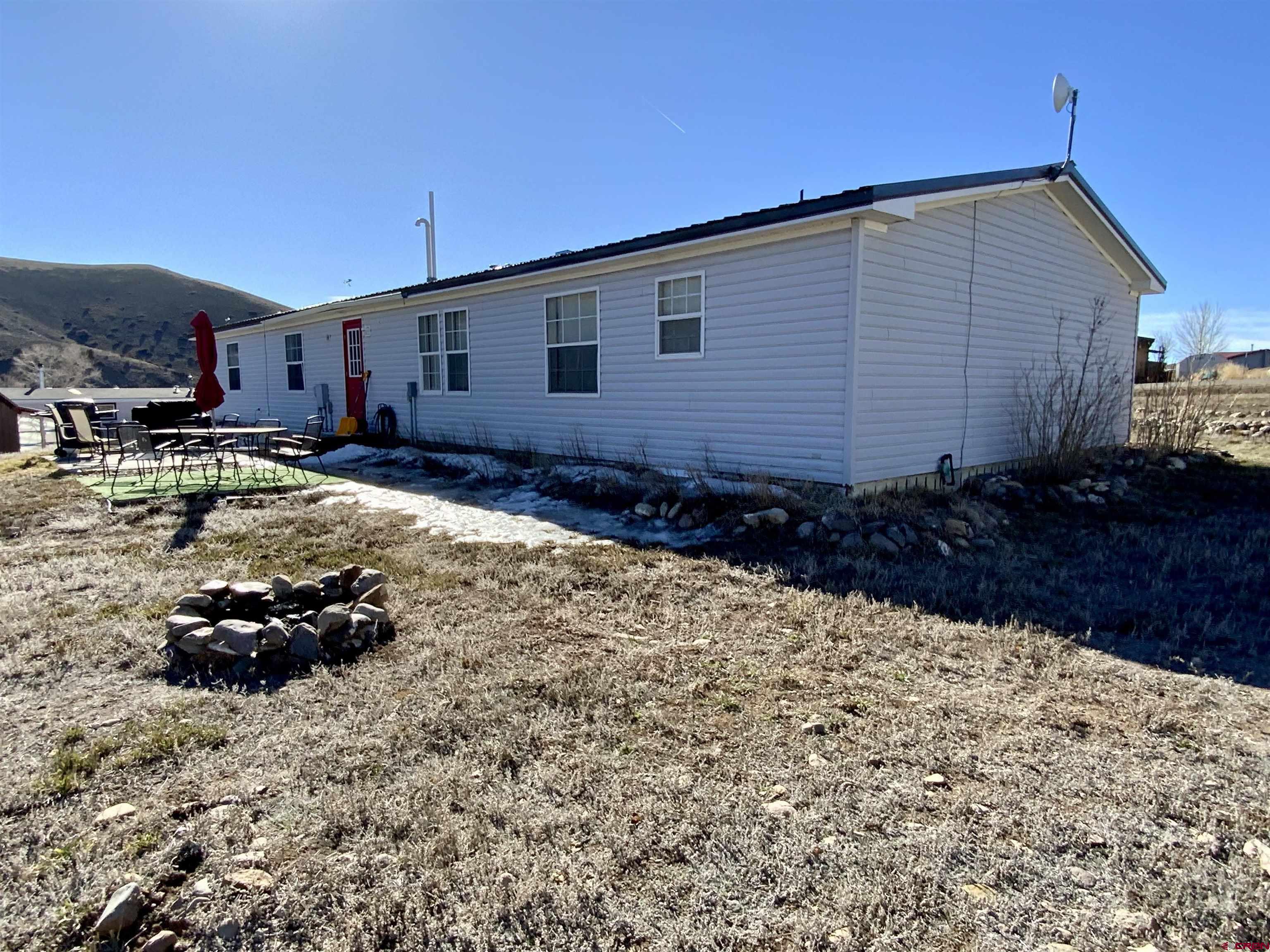 13 Ridge Lane Gunnison, CO 81230 - Photo 3 of 24 a backyard of a house