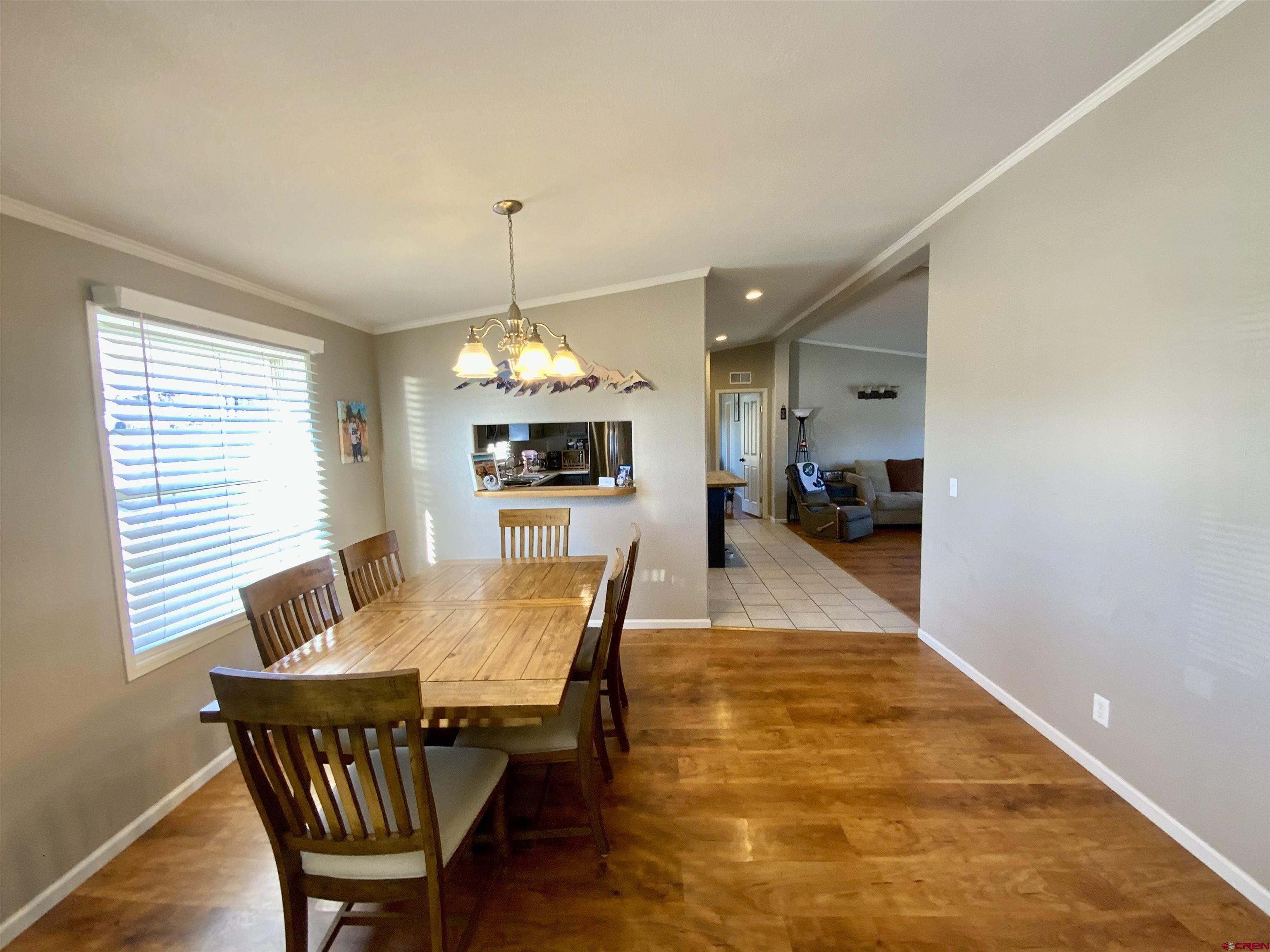 13 Ridge Lane Gunnison, CO 81230 - Photo 6 of 24 a dining room with furniture and window