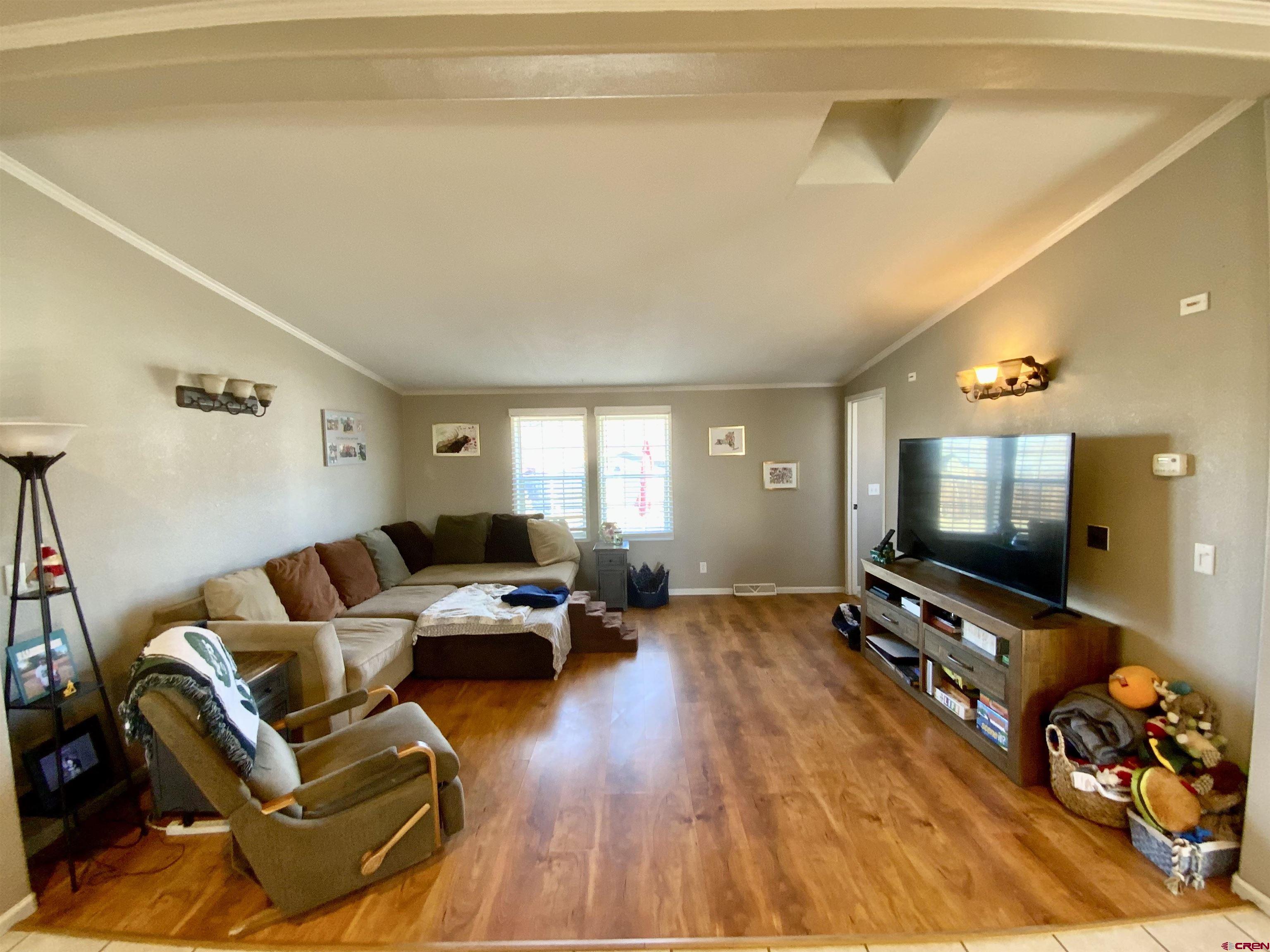 13 Ridge Lane Gunnison, CO 81230 - Photo 7 of 24 a living room with furniture and a flat screen tv