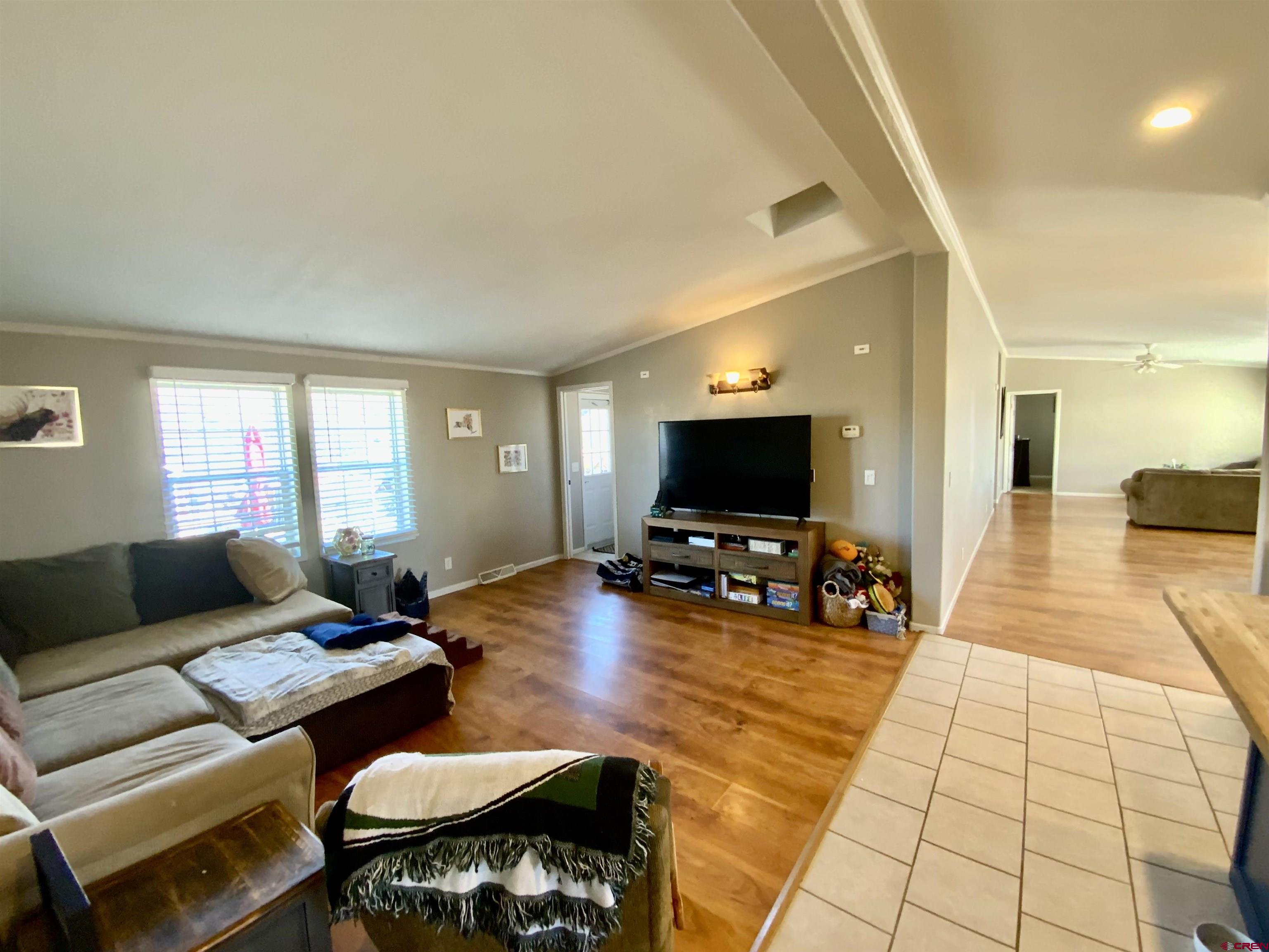 13 Ridge Lane Gunnison, CO 81230 - Photo 8 of 24 a living room with furniture and a flat screen tv