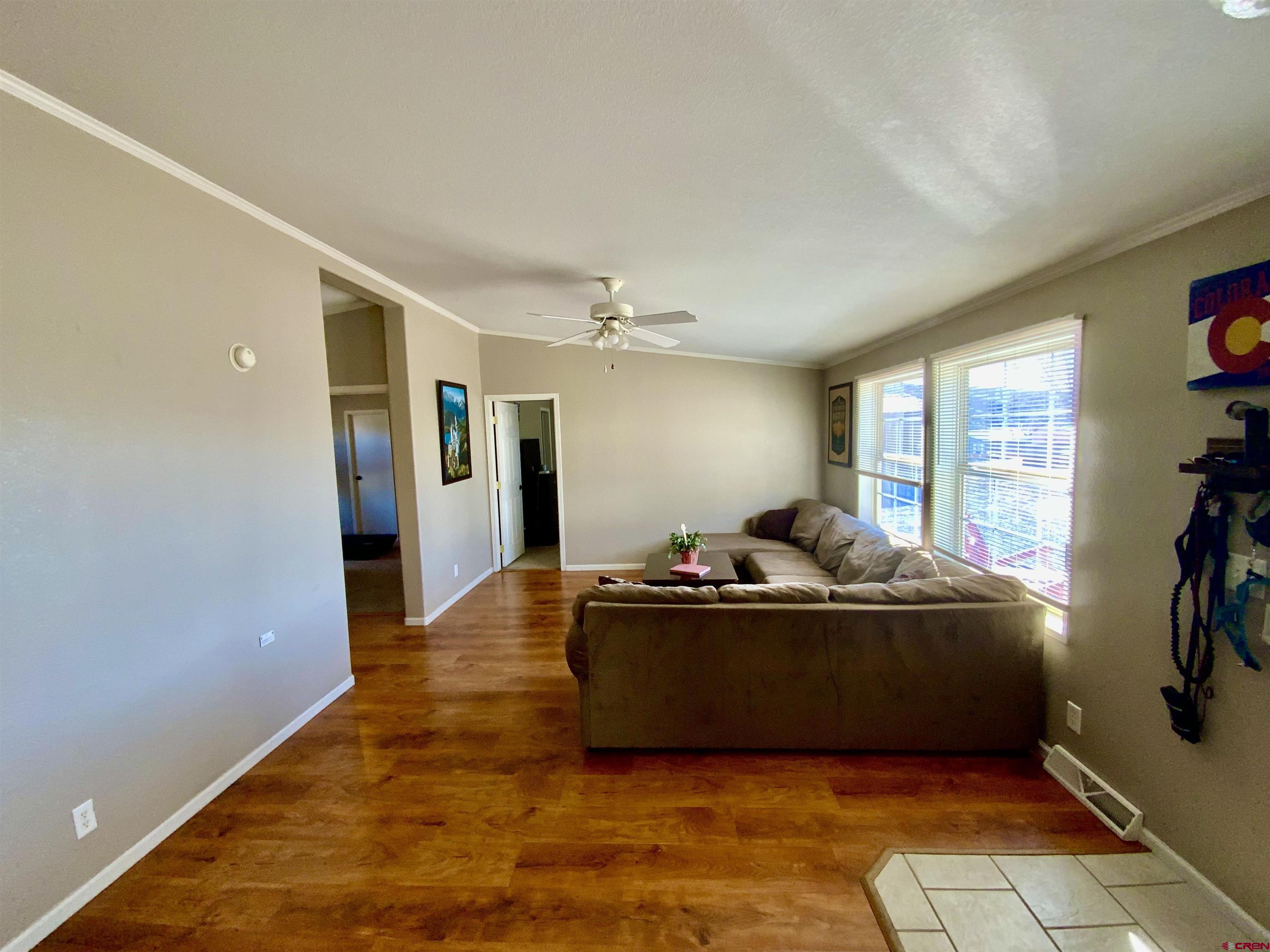 13 Ridge Lane Gunnison, CO 81230 - Photo 9 of 24 a living room with furniture and a flat screen tv