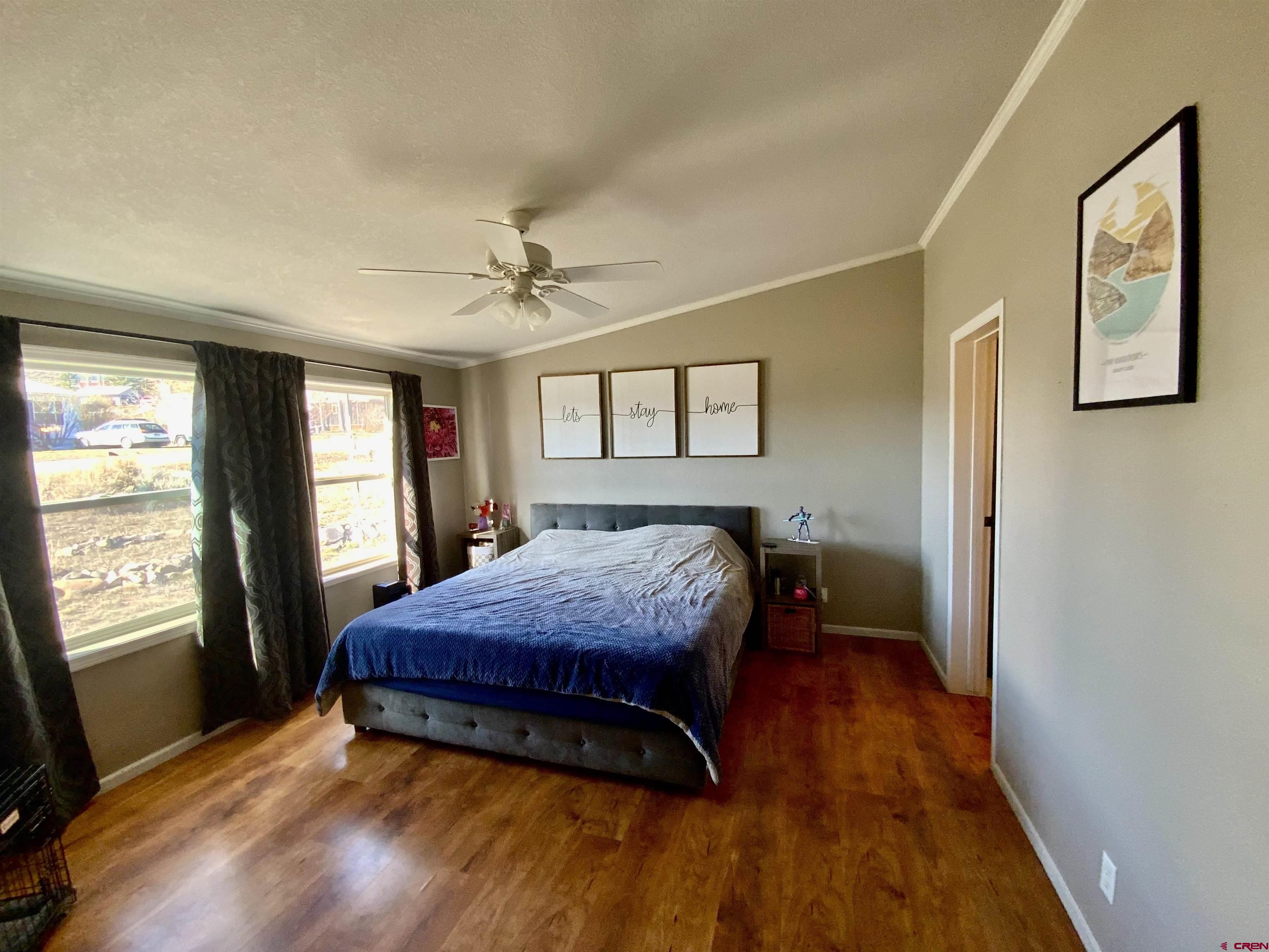 13 Ridge Lane Gunnison, CO 81230 - Photo 10 of 24 a bedroom with a bed and a window
