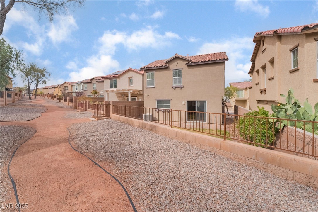 1152 Gecko Road Henderson, NV 89002 - Photo 30 of 32 View of property's community with a residential view and fence