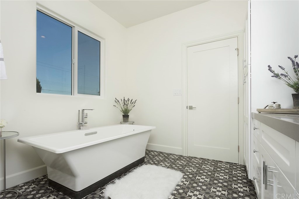 631 North Lucerne Boulevard Los Angeles, CA 90004 - Photo 12 of 21 a bathroom with a sink toilet and vanity