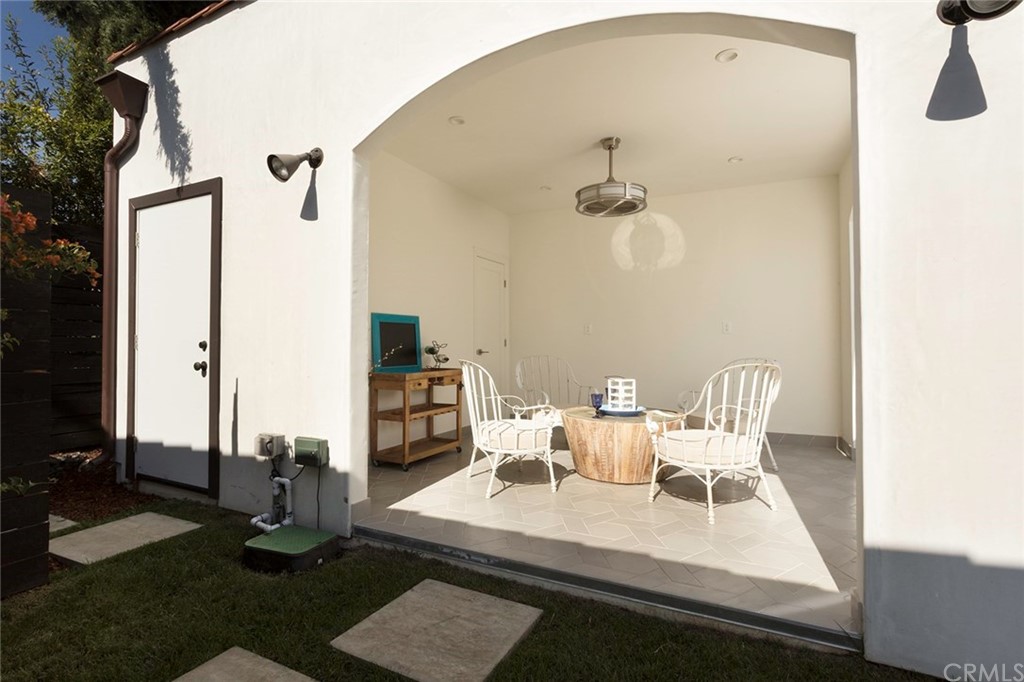 631 North Lucerne Boulevard Los Angeles, CA 90004 - Photo 18 of 21 a view of a dining room with furniture and a chandelier