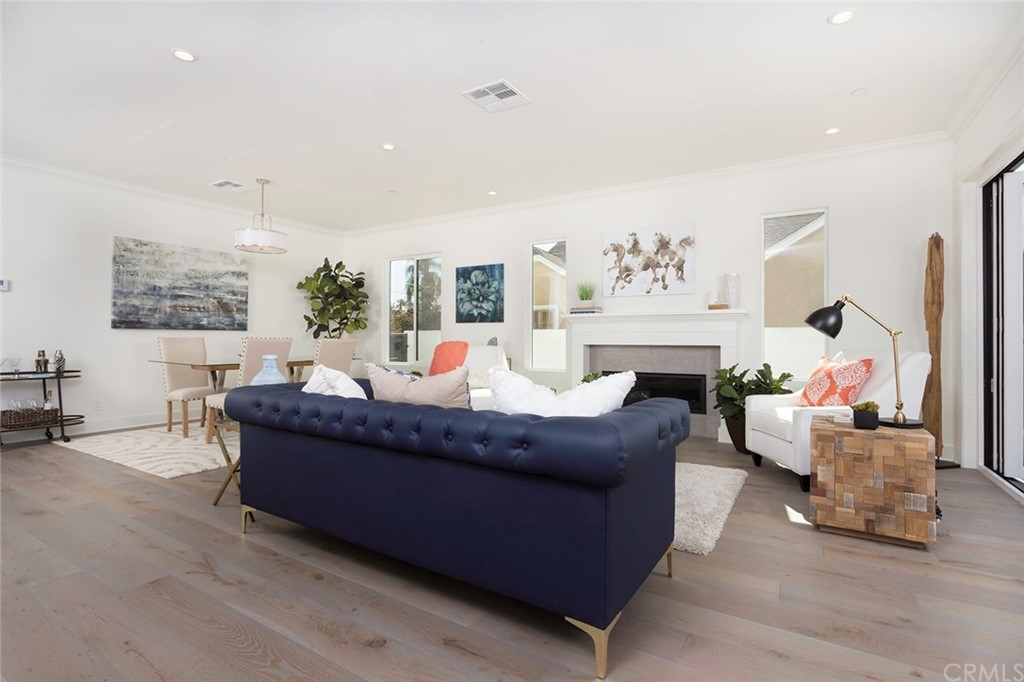 631 North Lucerne Boulevard Los Angeles, CA 90004 - Photo 4 of 21 a living room with furniture and a fireplace