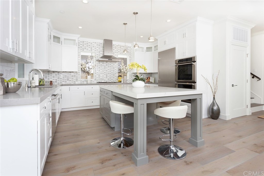 631 North Lucerne Boulevard Los Angeles, CA 90004 - Photo 6 of 21 a kitchen with kitchen island granite countertop a sink and counter space
