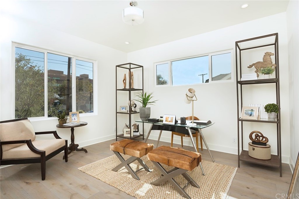 631 North Lucerne Boulevard Los Angeles, CA 90004 - Photo 8 of 21 a living room with furniture and a window
