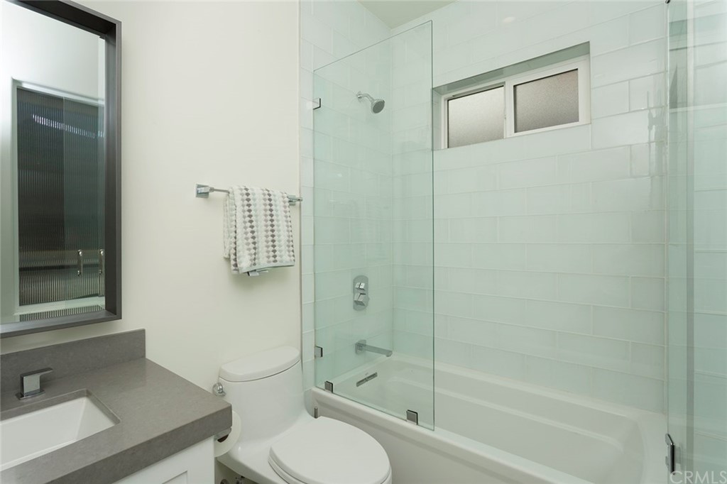 631 North Lucerne Boulevard Los Angeles, CA 90004 - Photo 9 of 21 a bathroom with a toilet and a shower