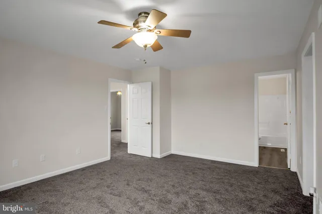 a view of a chandelier fan in a room