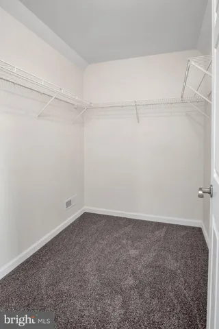 a view of an empty walk in closet