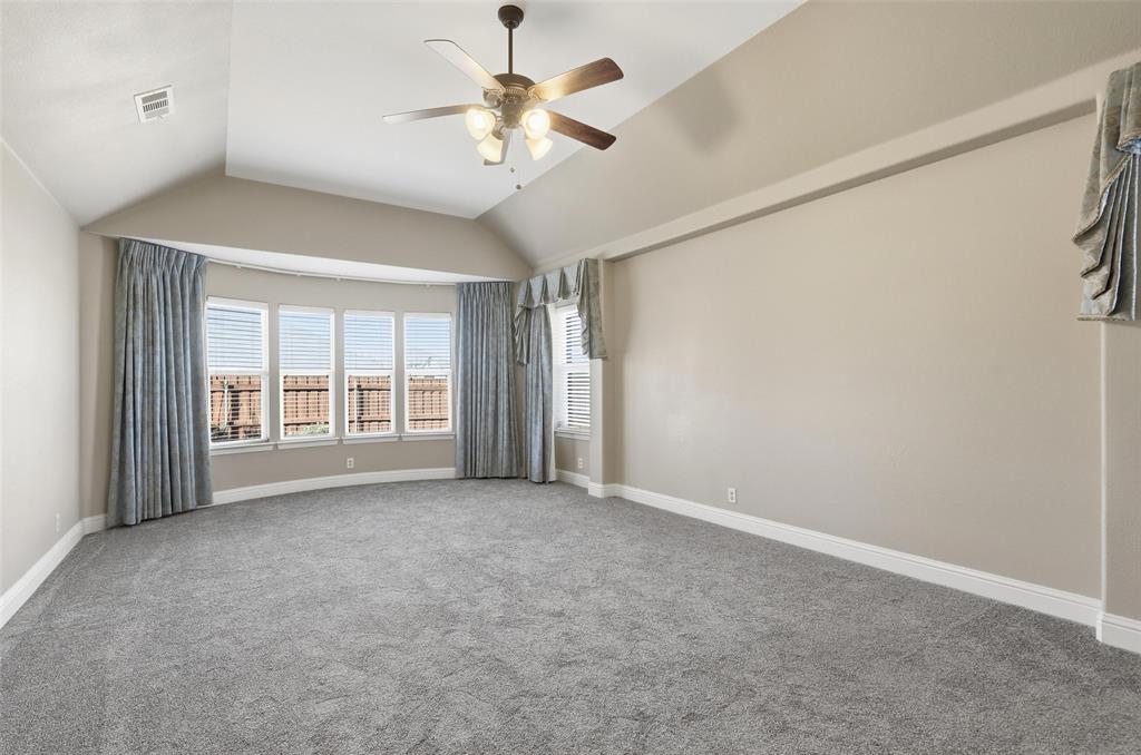 5224 Smokey Ridge Drive Fort Worth, TX 76123 - Photo 14 of 36 an empty room with windows and fan