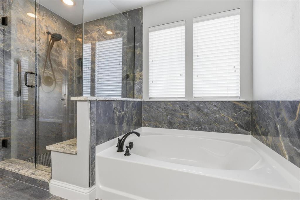 5224 Smokey Ridge Drive Fort Worth, TX 76123 - Photo 18 of 36 a bathroom with a bathtub and a shower