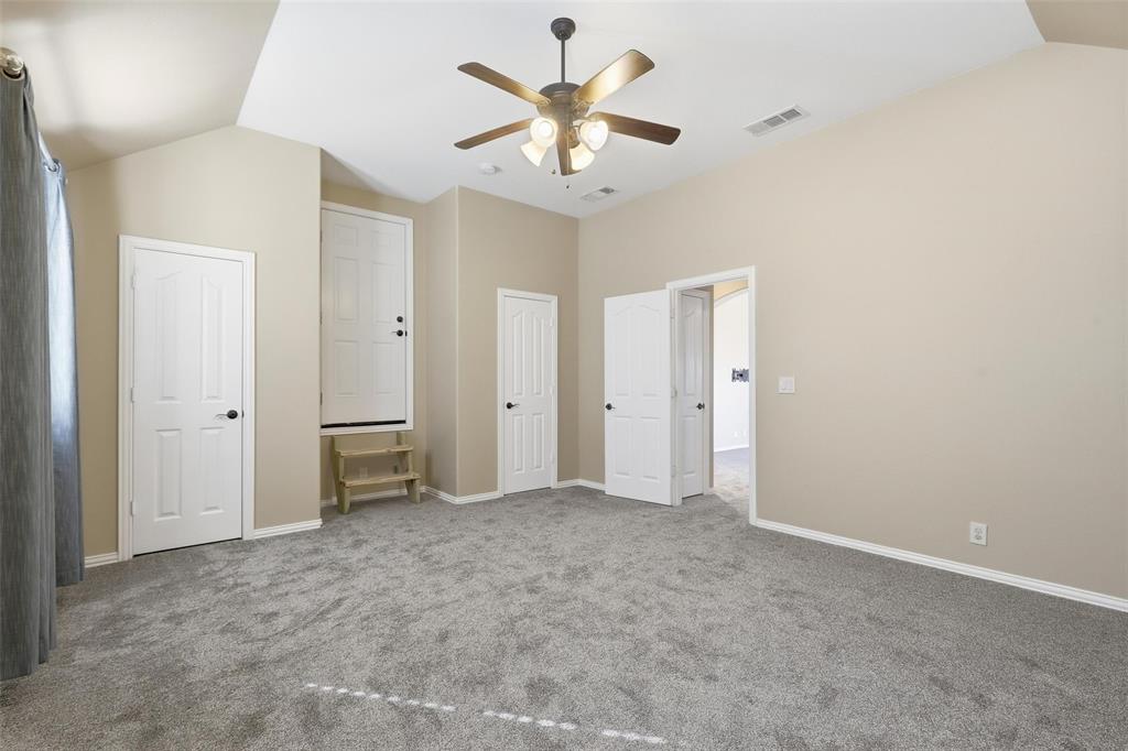 5224 Smokey Ridge Drive Fort Worth, TX 76123 - Photo 31 of 36 a view of an empty room with a ceiling fan