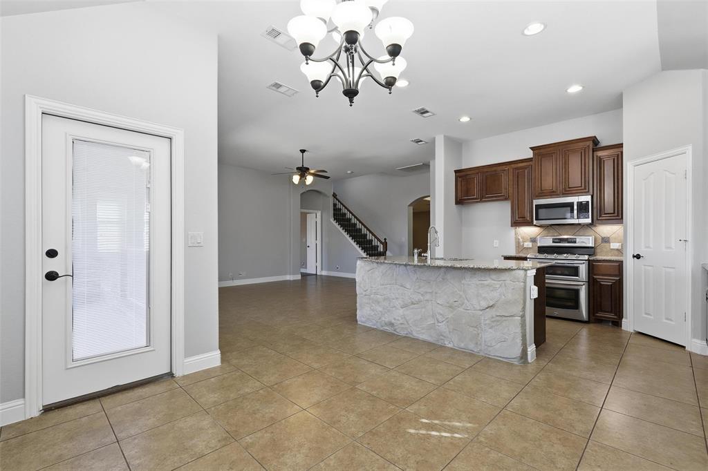 5224 Smokey Ridge Drive Fort Worth, TX 76123 - Photo 9 of 36 a view of kitchen with microwave and cabinets