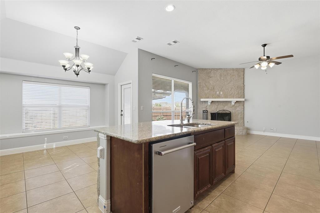 5224 Smokey Ridge Drive Fort Worth, TX 76123 - Photo 10 of 36 a kitchen with stainless steel appliances a sink stove and cabinets