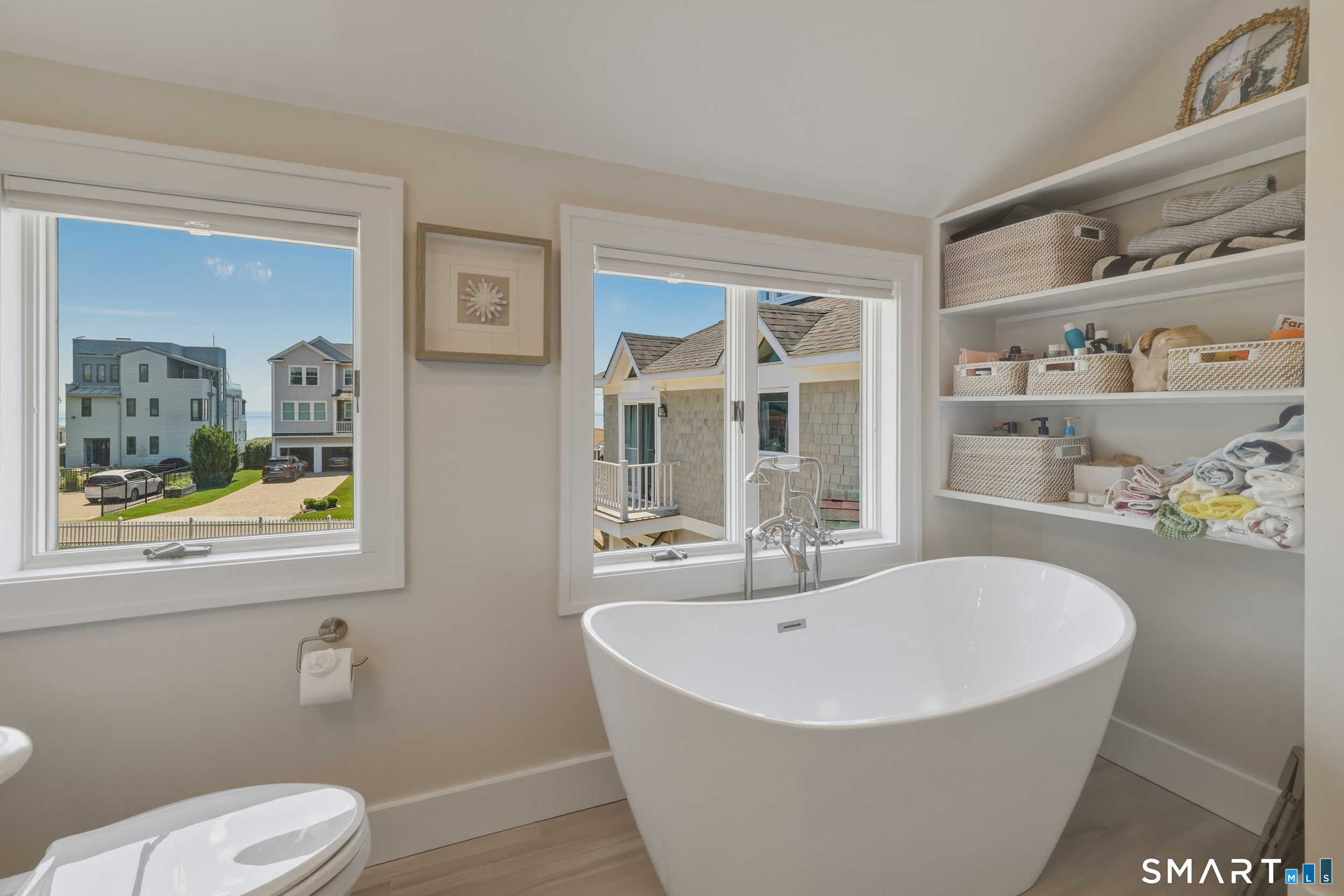 31 Sols Point Road Clinton, CT 06413 - Photo 19 of 40 Full bath with shower, soaking tub, and storage shelves.