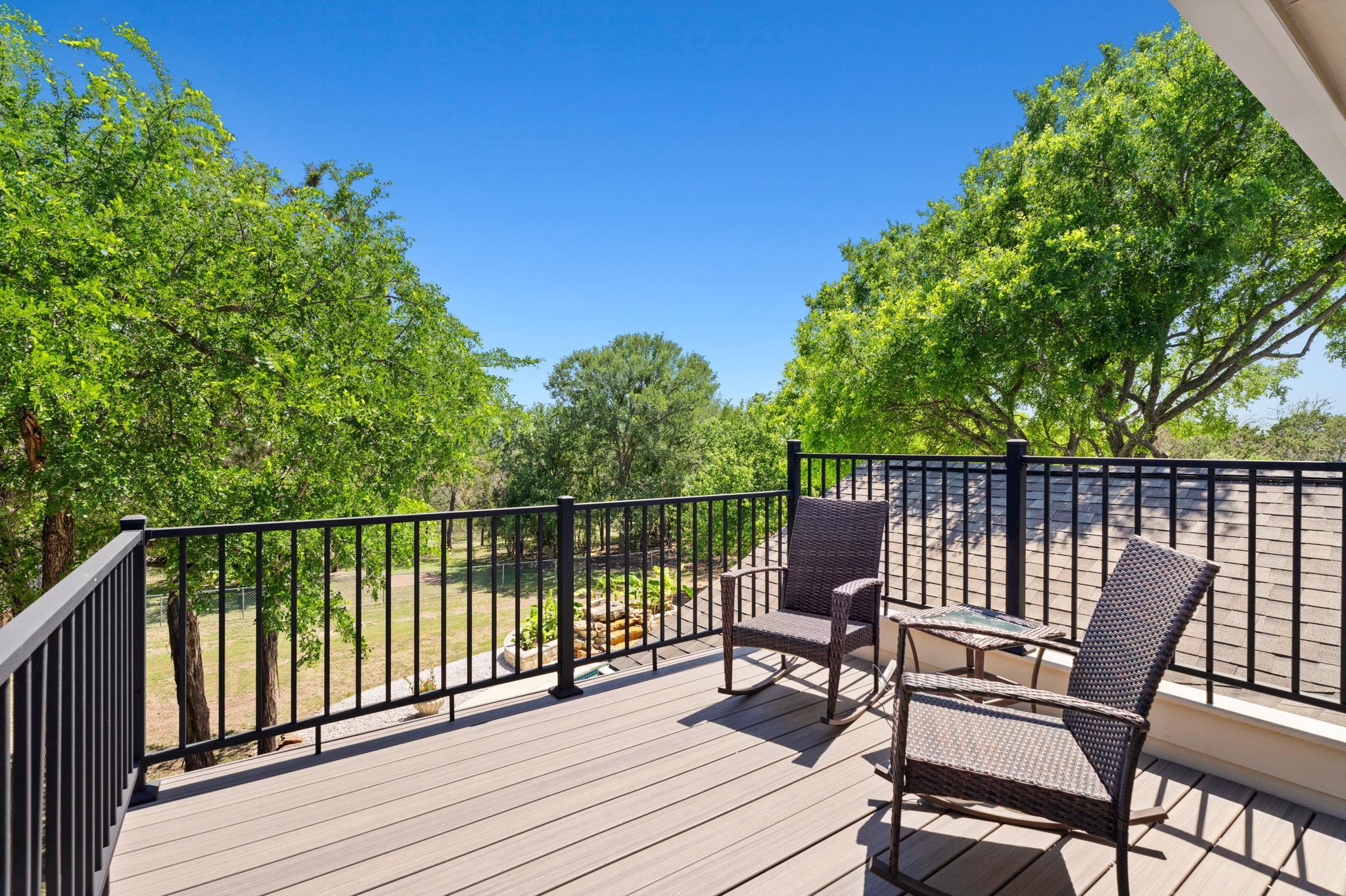 2409 Mormon Mill Road Marble Falls, TX 78654 - Photo 13 of 30 a view of a chair and table on the deck
