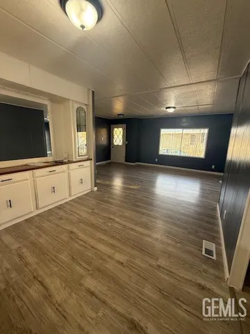a view of a livingroom with wooden floor