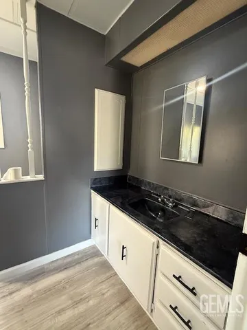 a kitchen with granite countertop cabinets and stove