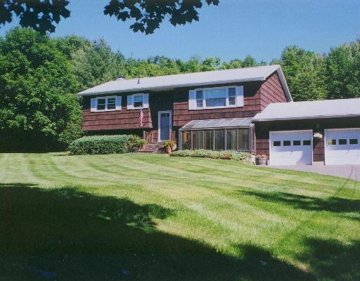 45 Mendes Road Danbury, CT 06811 - Photo 1 of 1 a front view of a house with a garden