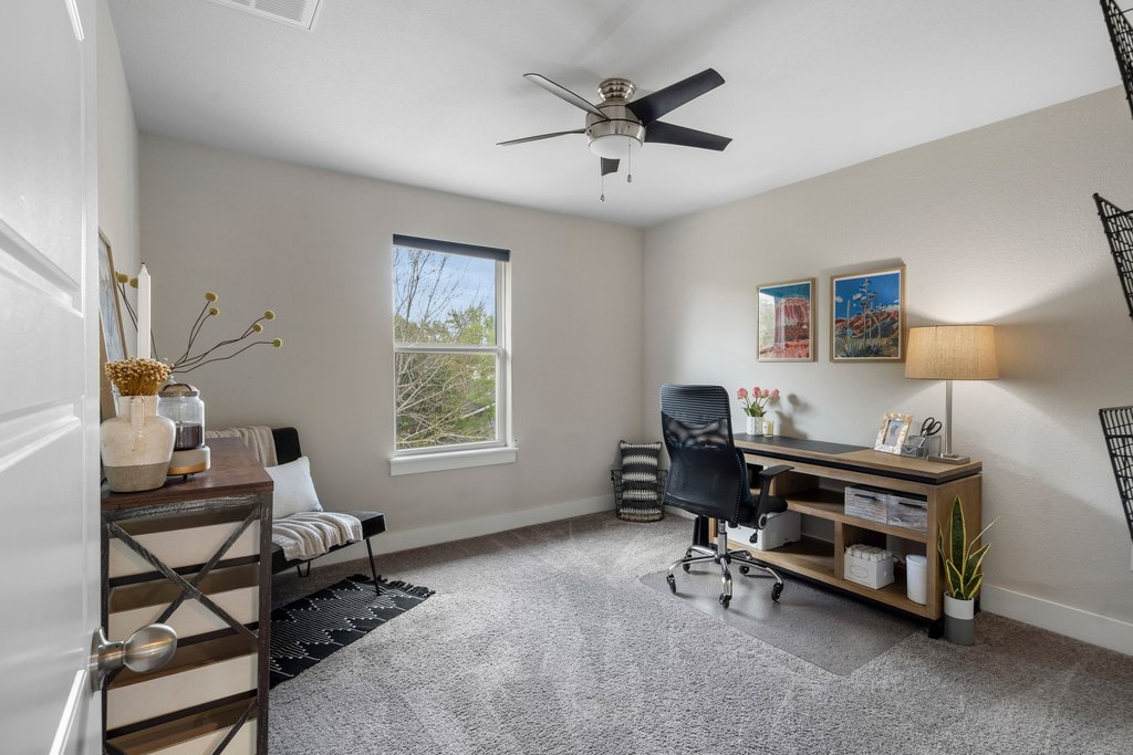 610 Bernstein Street, Unit 14 Austin, TX 78745 - Photo 25 of 39 Office area with light colored carpet and ceiling fan