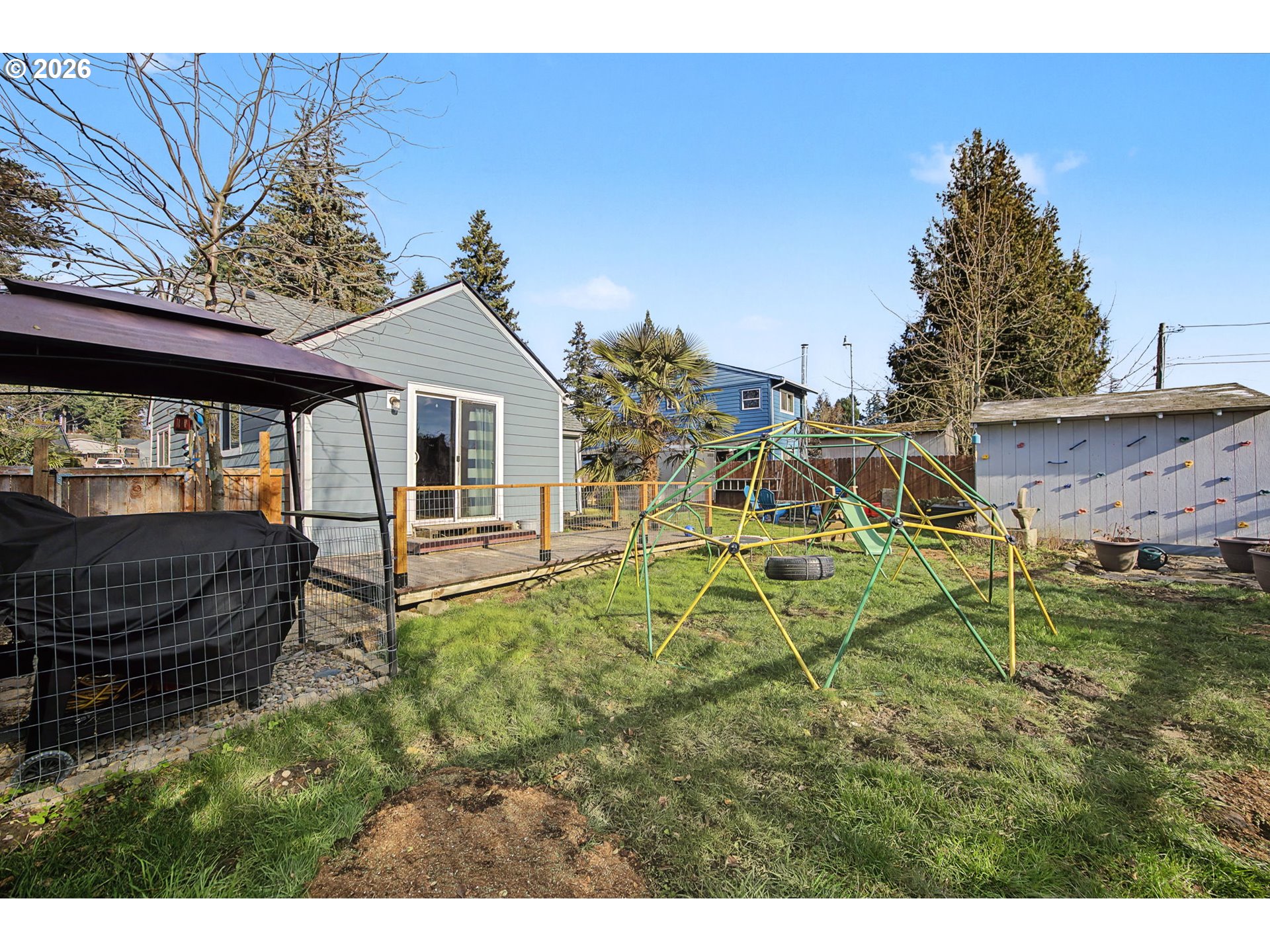 7808 Southeast Roots Road Milwaukie, OR 97267 - Photo 7 of 13 a view of a house with a yard
