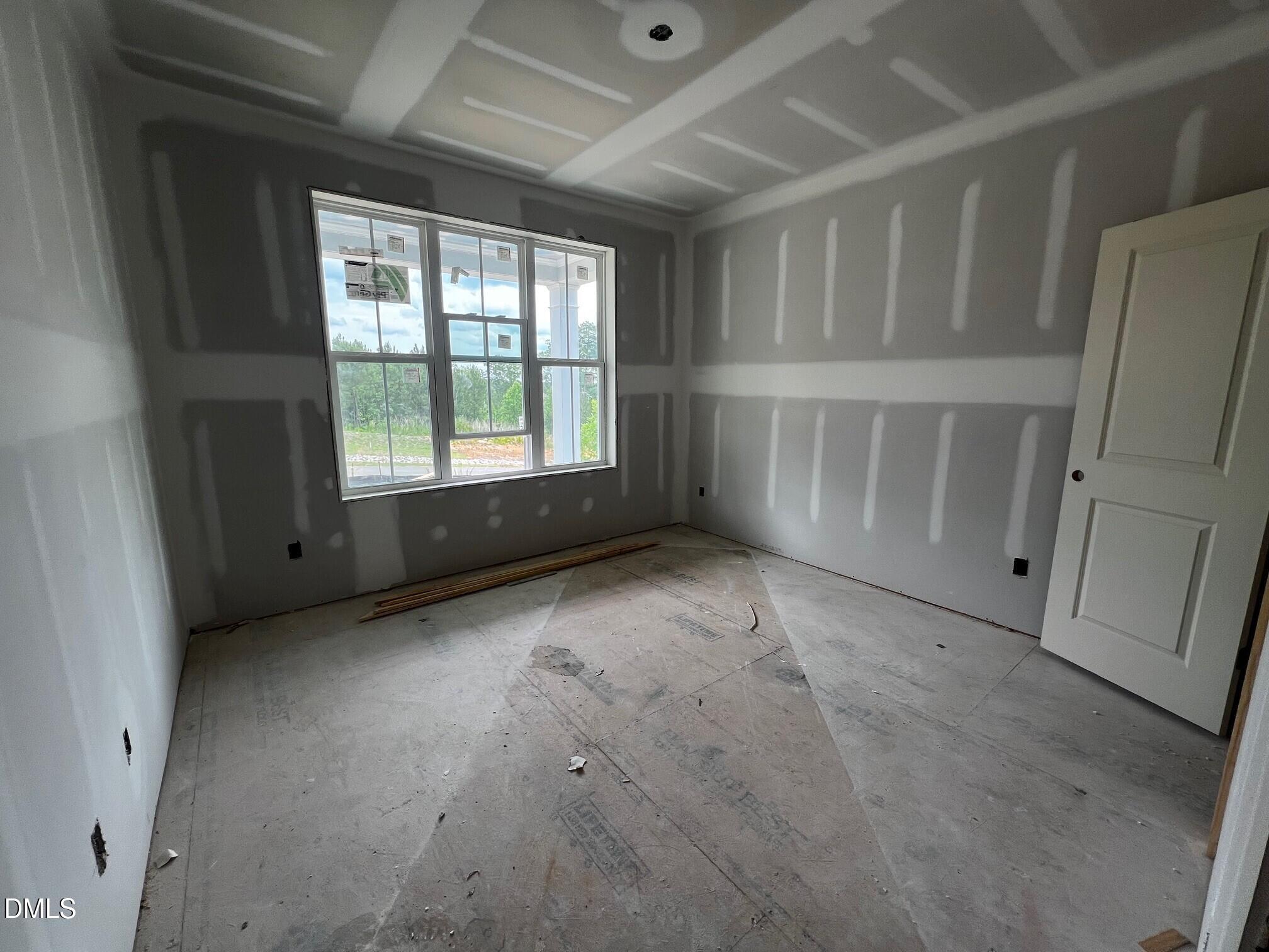 1675 Terry Road Durham, NC 27712 - Photo 9 of 23 a view of an empty room with a window