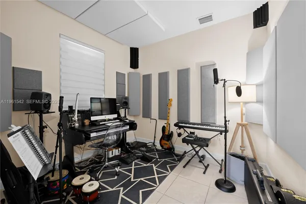a view of a workspace with furniture and rug
