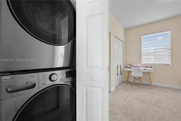 a utility room with dryer and washer