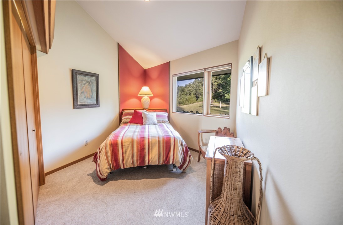 36815 Mann Road Sultan, WA 98294 - Photo 14 of 38 a bedroom with a bed and a window