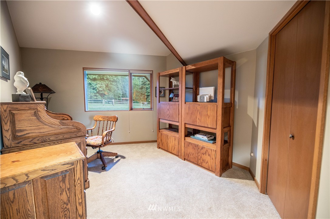 36815 Mann Road Sultan, WA 98294 - Photo 15 of 38 a bed room with a bed and furniture