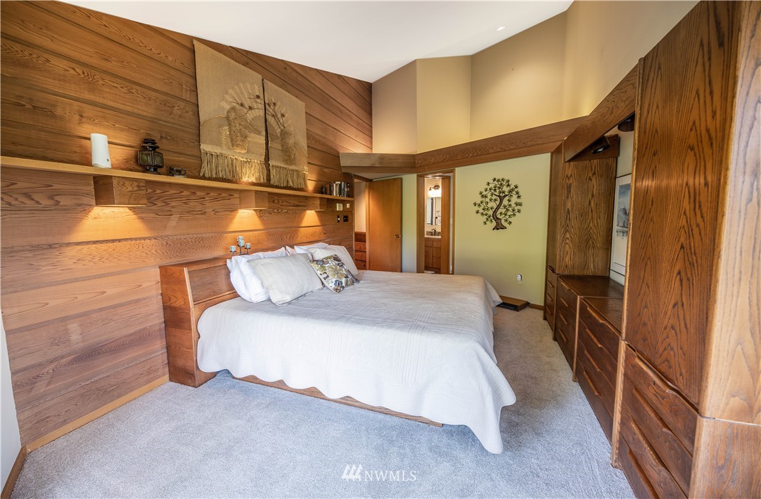 36815 Mann Road Sultan, WA 98294 - Photo 16 of 38 a bedroom with a bed and wooden floor