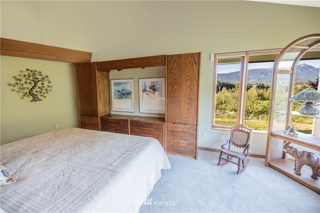 36815 Mann Road Sultan, WA 98294 - Photo 17 of 38 a bedroom with a bed and a large window