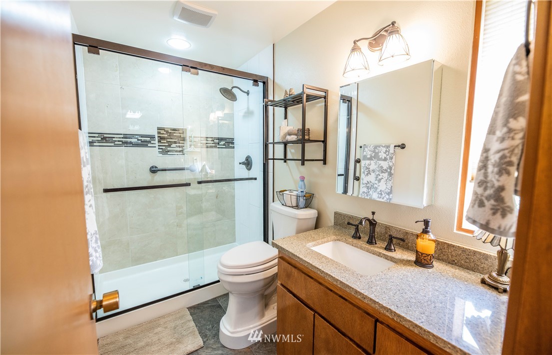 36815 Mann Road Sultan, WA 98294 - Photo 18 of 38 a bathroom with a sink toilet and shower