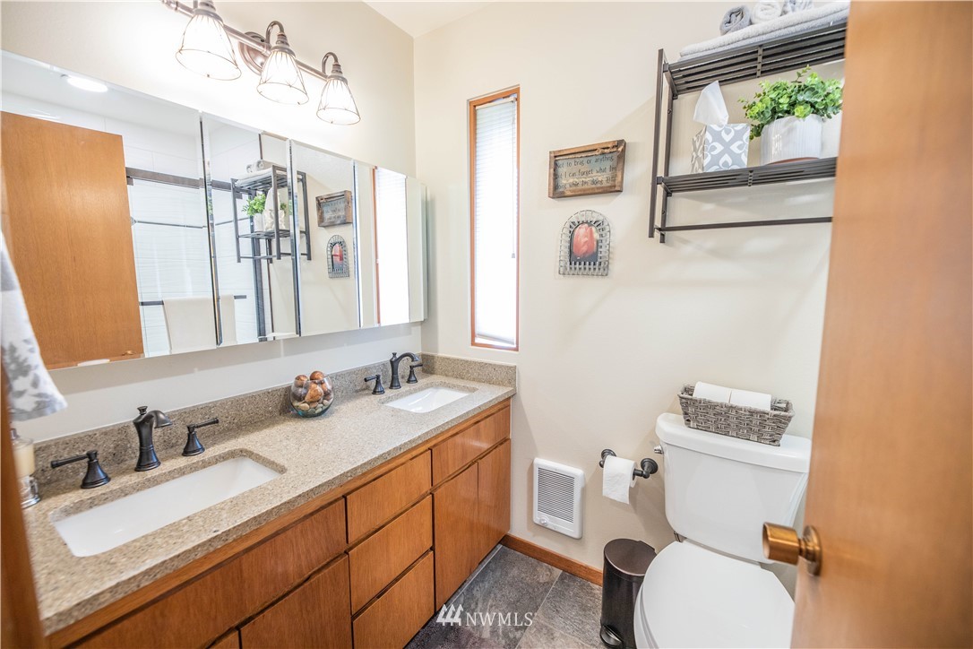 36815 Mann Road Sultan, WA 98294 - Photo 19 of 38 a bathroom with a sink vanity mirror and toilet