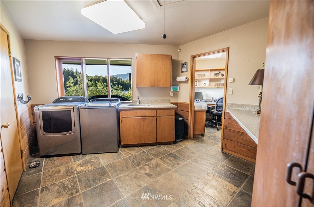 36815 Mann Road Sultan, WA 98294 - Photo 20 of 38 a kitchen with sink cabinets and window