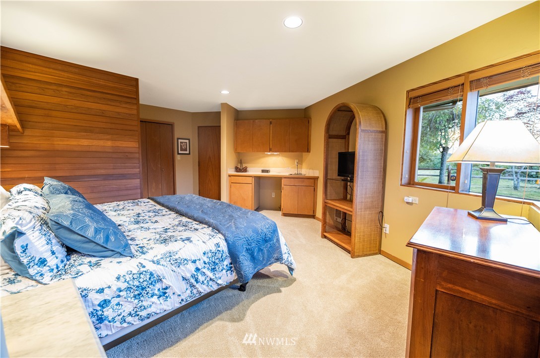 36815 Mann Road Sultan, WA 98294 - Photo 22 of 38 a bedroom with a large bed and a dresser