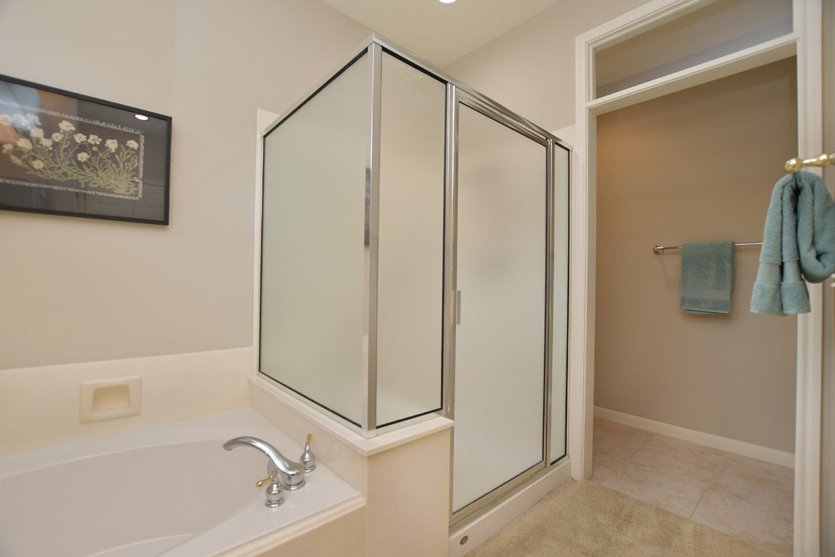 114 Lone Star Drive Georgetown, TX 78633 - Photo 22 of 30 A separate bath and standalone shower offer daily choices in the primary bathroom.