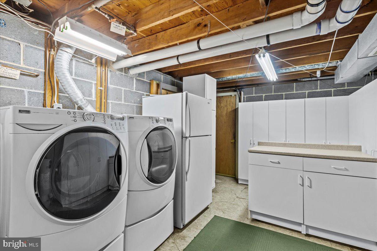 63 Estates Road Pine Hill, NJ 08021 - Photo 29 of 46 lower level laundry and storage area