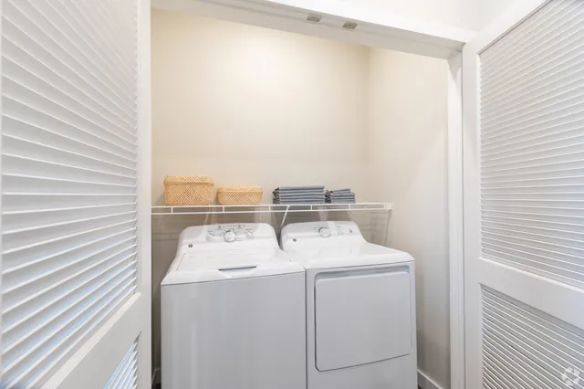 a utility room with dryer and washer