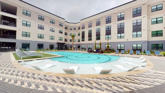 a view of a building with a yard