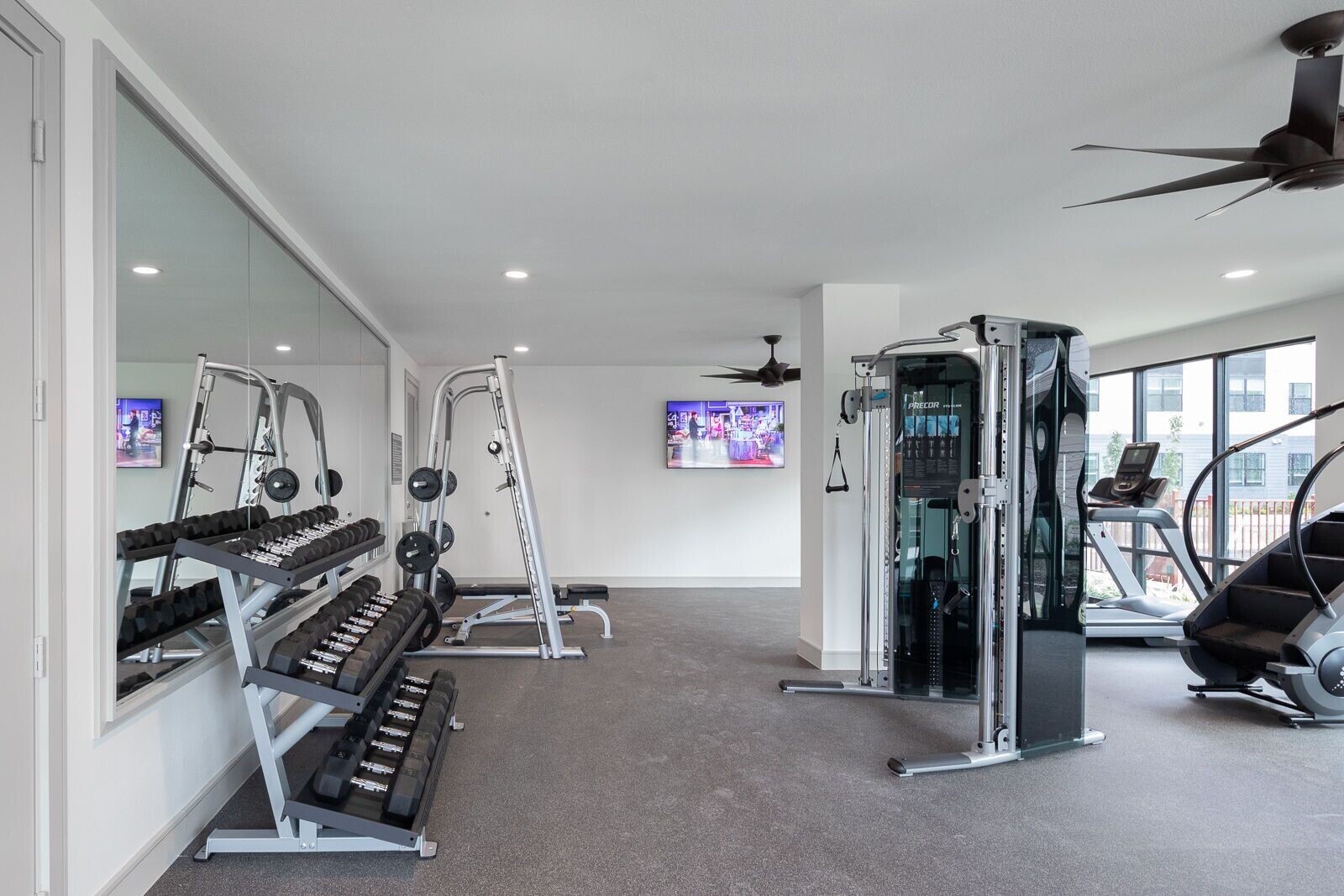 1148 Silber Road, Unit 8301 Houston, TX 77055 - Photo 24 of 36 a view of a room with gym equipment