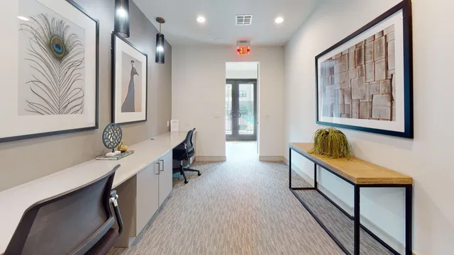 a hallway with a large mirror on a dresser